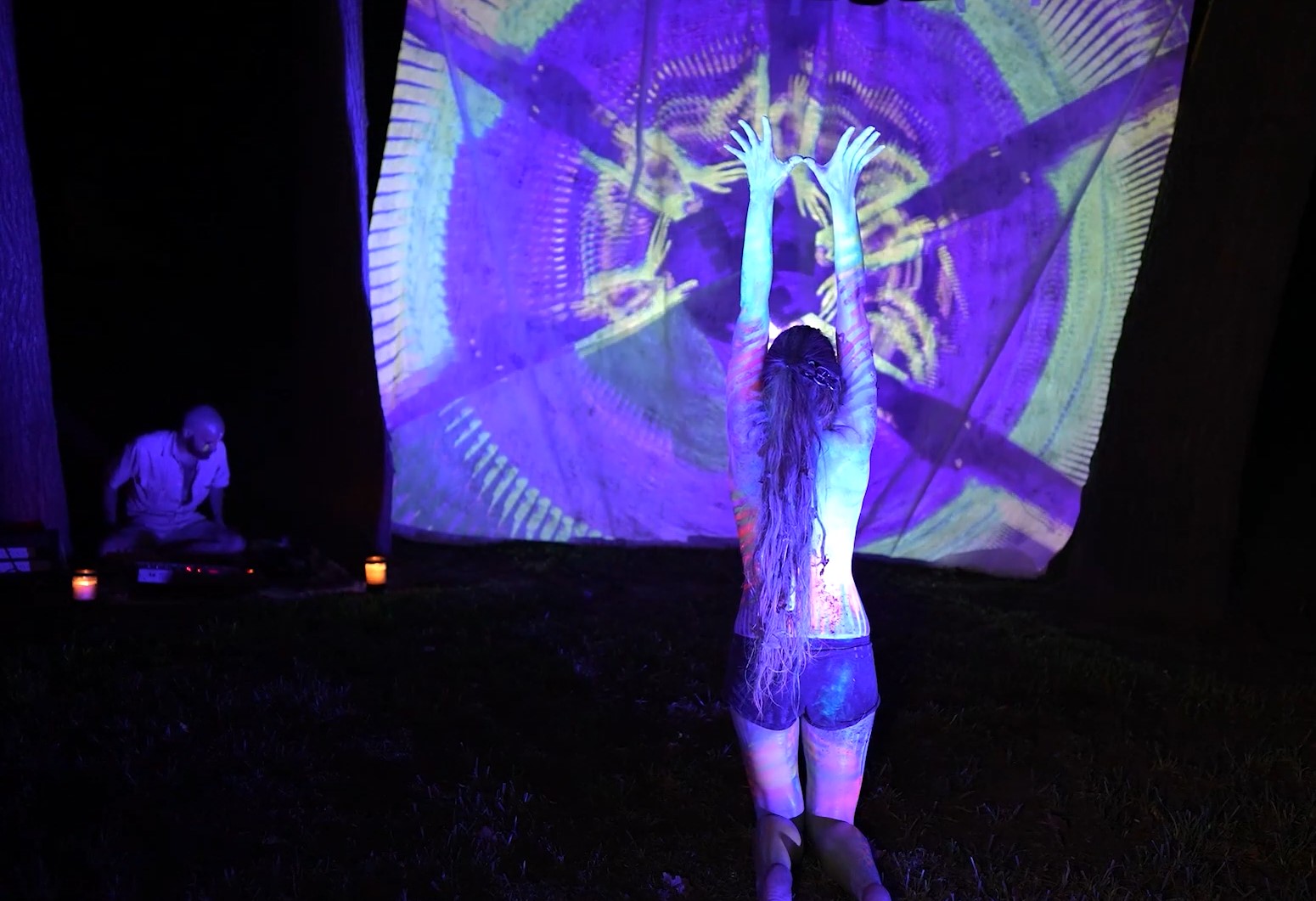 Dancer performing within an interactive projection